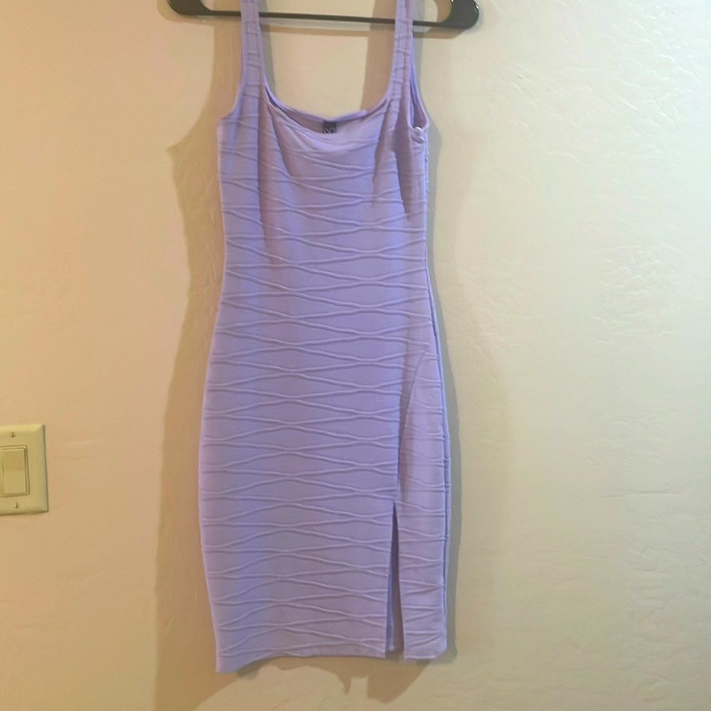 Form fitting textured dress with slit on front